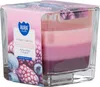 A scented candle with a gradient of pink and purple colors, packaged in a clear glass container with a decorative label. Voir les images du produit