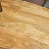 A close-up view of a wooden table surface. Produktbild-Vorschau