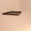A baking tray is placed on a light-colored surface in a corner with light walls. Voir les images du produit