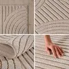 A collage of images showing a beige bouclé rug with a striped pattern, including a close-up of the texture and a hand touching the rug. Podgląd zdjęcia produktu
