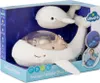 The product is a white plush whale toy with a transparent dome on its back, displayed inside its retail packaging. Anteprima dell’immagine prodotto