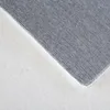 A close-up view of the texture of a rug, showing the woven backing and the fluffy pile. Anteprima dell’immagine prodotto