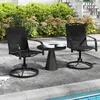 Two black swivel patio chairs and a small black side table are set up on a patio next to a swimming pool. Produktbild-Vorschau
