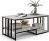 A coffee table with a marble-like top and black metal frame, decorated with books, a decorative bowl, candles, and a plant. Produktbild-Vorschau