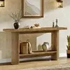 A wooden console table with decorative items on it and a basket and vase on the shelf below. Podgląd zdjęcia produktu