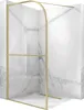 A shower wall with a gold frame and clear glass panels, set against a marble-patterned background. Náhled obrázku produktu