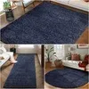 A collage of images showing different sizes and placements of a navy blue rug in various home settings. Produktbild-Vorschau