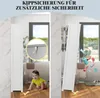 A split image showing a bathroom cabinet. The left side shows the cabinet upright with a baby crawling nearby and a close-up of an anti-tip bracket. The right side shows the cabinet tipping over with toiletries falling out. Produktbild-Vorschau