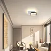 A modern living room with a ceiling light, artwork, and furniture. Produktbild-Vorschau