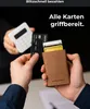 A person is holding a brown cardholder with several cards inside, while another person in the background is holding a white payment terminal and a black credit card. Produktbild-Vorschau