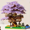 A detailed model of a treehouse with purple cherry blossoms, built from construction blocks. Náhľad obrázku produktu