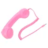 A pink retro telephone handset with a coiled cord and a 3.5mm jack connector, isolated on a white background. Náhľad obrázku produktu