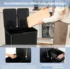 A person is placing a wooden cutting board into a dishwasher next to a black dual-compartment trash can. Náhled obrázku produktu