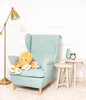 A plush octopus toy sits on a light blue armchair next to two small side tables. A floor lamp is on the left. Anteprima dell’immagine prodotto
