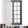 A white sheer curtain is shown hanging in front of a dark-framed window with multiple panes. Below the main image, there are swatches of different colored fabric, likely representing other color options for the curtain. Produktbild-Vorschau