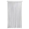 A white curtain hanging from a rod. Náhľad obrázku produktu