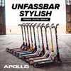 A line of colorful stunt scooters displayed on a concrete floor with a blurred background of a building and open space. Produktbild-Vorschau