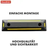 A black parking bumper with yellow stripes and text overlays. Náhled obrázku produktu