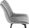 A close-up side view of a grey upholstered chair. Produktbild-Vorschau