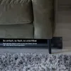 A green screen is shown tucked away under a couch, highlighting its compact and discreet storage. Anteprima dell’immagine prodotto