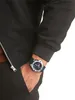 A person's wrist wearing a watch. Produktbild-Vorschau