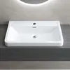 A white rectangular sink is placed on a dark gray vanity. A circular light is visible in the background. Produktbild-Vorschau