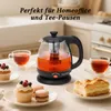A glass electric kettle with tea, cups, and pastries on a table. Produktbild-Vorschau