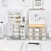 A desk setup with organizers, stationery, and decorative items. Produktbild-Vorschau