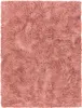 A close-up, top-down view of a pink shag rug. Produktbild-Vorschau