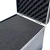 Close-up view of the interior of an open aluminum case with foam padding. Produktbild-Vorschau