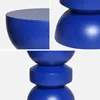 A collage of three close-up images of a blue, matte-finished side table. Produktbild-Vorschau