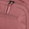 A close-up view of the zippers and textured fabric of a rose-colored backpack. Produktbild-Vorschau