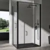 A modern black framed shower enclosure with a black shower tray and black shower fixtures, set against a concrete-like wall. Natural light casts shadows across the scene. Voir les images du produit