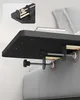 A black bedside shelf is clamped to the side of a bed. Produktbild-Vorschau