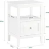 A white bedside table with dimensions indicated by measurement lines and text. Náhľad obrázku produktu