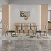 A dining room setting with a table and chairs. Produktbild-Vorschau