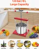 A red and silver fruit press is shown in a kitchen setting, with various fruits and juices displayed around it. Produktbild-Vorschau