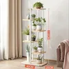 A multi-tiered plant stand with various potted plants displayed in a room with beige curtains. Náhľad obrázku produktu