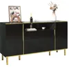 A black sideboard with gold accents and legs, decorated with a framed picture, a diffuser, and a vase with flowers. Produktbild-Vorschau