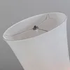 Close-up view of the top of a white fabric lampshade, showing the internal metal frame. Produktbild-Vorschau