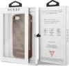 The image shows a product package for a Guess phone case. The front of the package displays the phone case through a clear window, and the back of the package has product information and graphics. Voir les images du produit