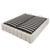A white upholstered bed frame with a slatted mattress base, shown from a diagonal angle against a white background. Produktbild-Vorschau