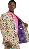 A man wearing a colorful polka dot suit and pink shirt. Anteprima dell’immagine prodotto