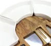A close-up view of a cheese board with white ceramic serving dishes and integrated cheese knives and a fork. Náhľad obrázku produktu