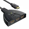 A black HDMI splitter with three input ports and an attached cable is shown against a white background. Produktbild-Vorschau