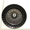 A black plastic wheel with a metal bearing in the center, placed on a white background with a ruler to the left and bottom. Produktbild-Vorschau