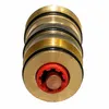 A close-up studio shot of a brass faucet cartridge with a red plastic component and a copper stem. Produktbild-Vorschau