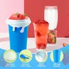 A product image showcasing a blue slushy maker cup with strawberries and a red beverage, accompanied by informational graphics. Podgląd zdjęcia produktu