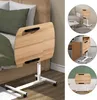 A mobile laptop table is shown next to a bed, with inset images showing it used next to a sofa and a desk. Produktbild-Vorschau