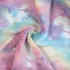 A close-up of a soft, fluffy blanket with a tie-dye pattern and a unicorn print. Náhľad obrázku produktu